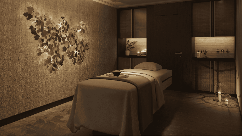 grey room with a messaging bed and Pellow and a bowl on the bed